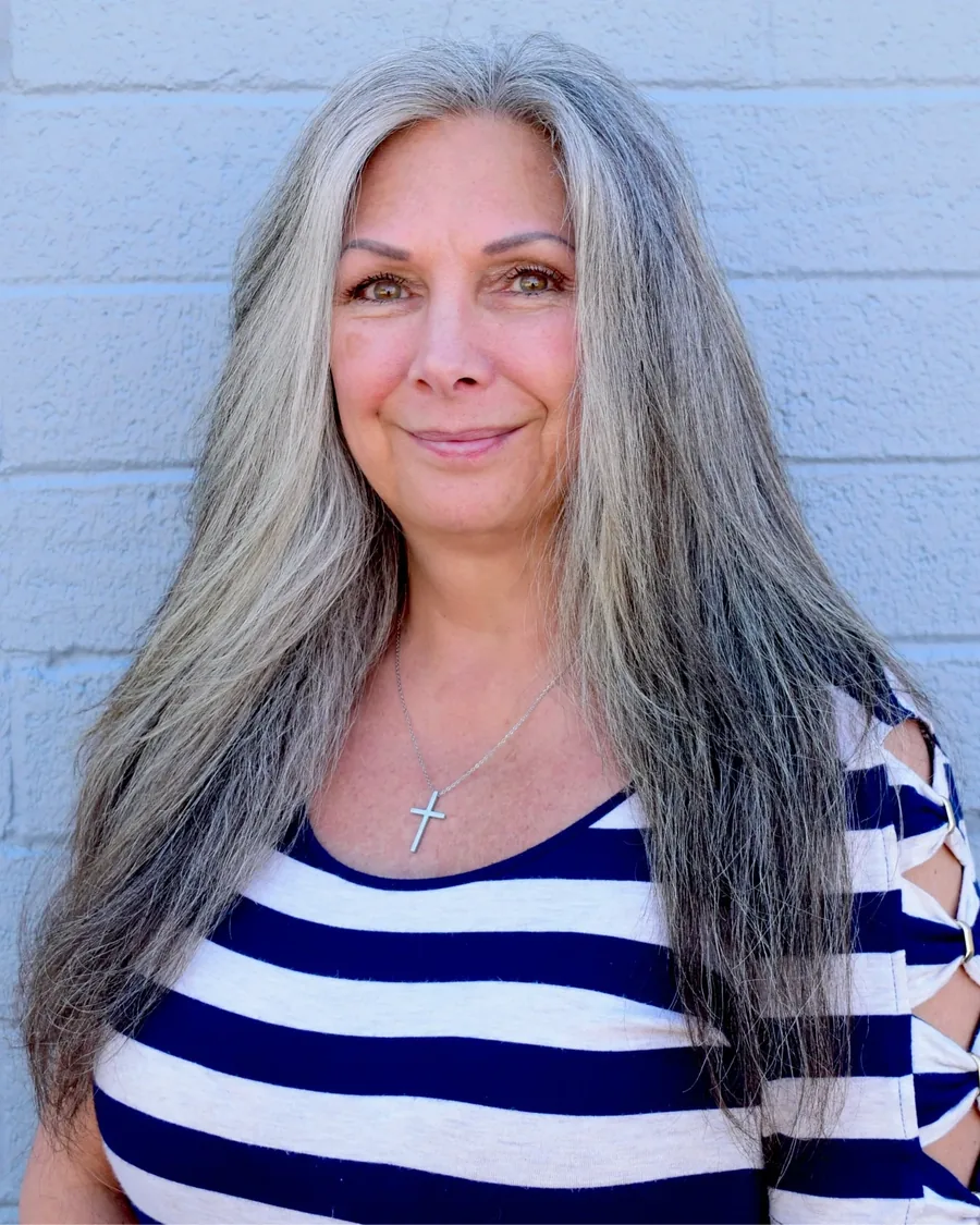 Portrait of Angela Thomas at the Proof front desk
