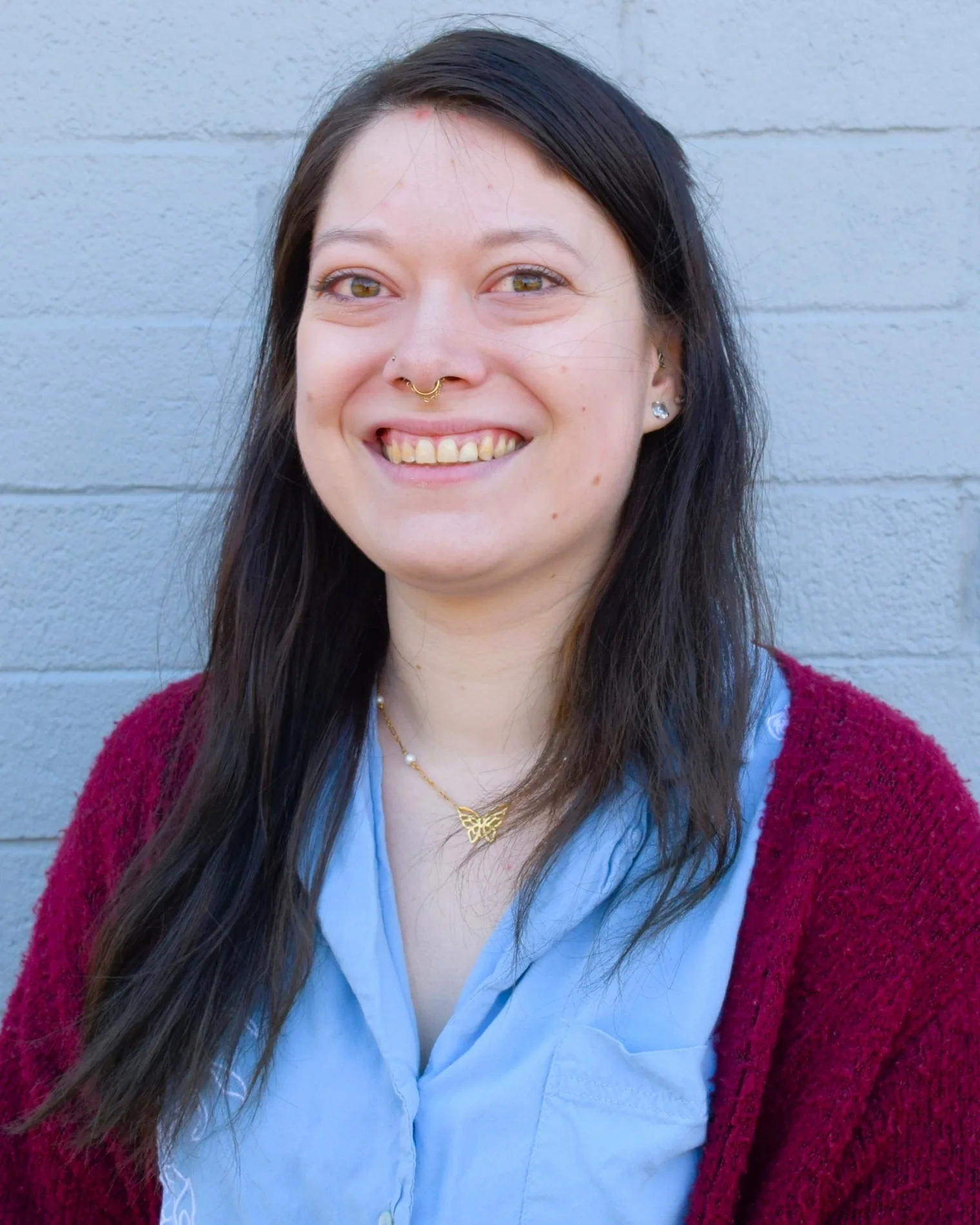 Portrait of Emily at the Proof front desk