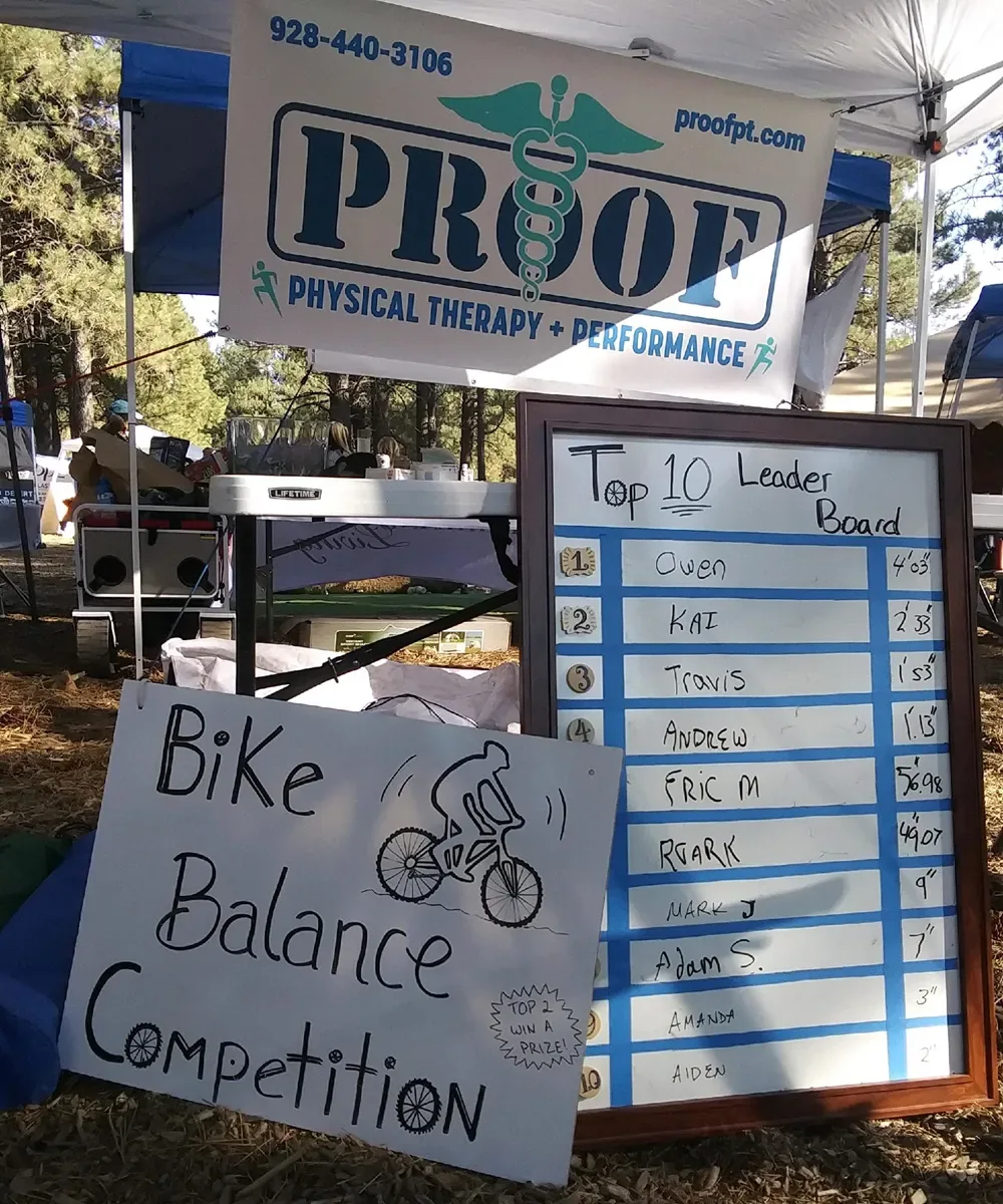 The Proof Physical Therapy booth at a community event in the Flagstaff pines